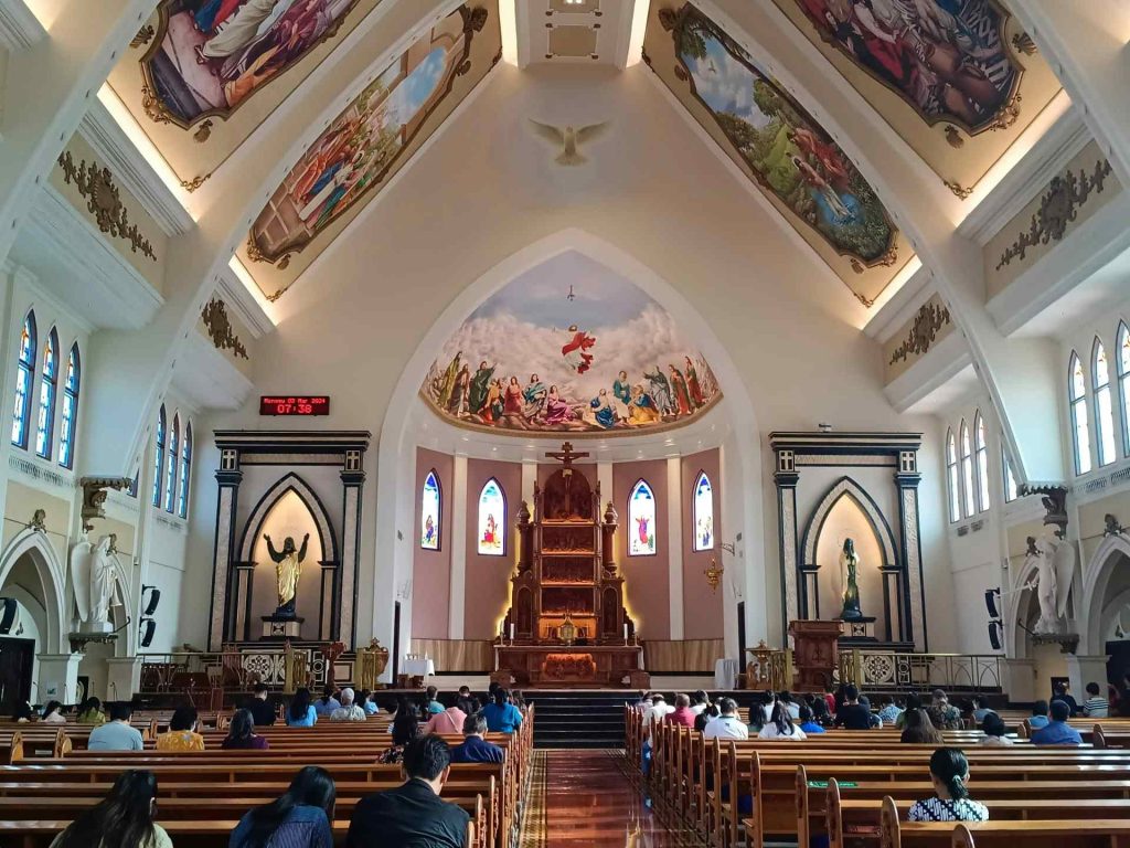 a church filled with lots of people sitting down
